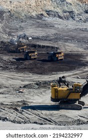 Panoramic Aerial View Of Coal Mine. Open Pit Mine Industry, Big Yellow Mining Truck For Coal Quarry. Open Coal Mining Anthracite Mining. Pit On Coal Mining By Open Way. 