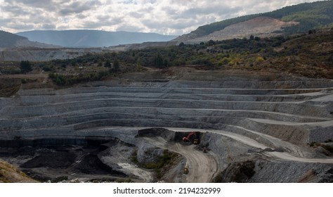 Panoramic Aerial View Of Coal Mine. Open Pit Mine Industry, Big Yellow Mining Truck For Coal Quarry. Open Coal Mining Anthracite Mining. Pit On Coal Mining By Open Way. 