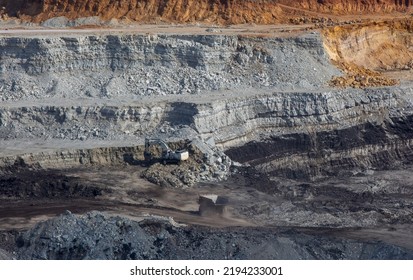 Panoramic Aerial View Of Coal Mine. Open Pit Mine Industry, Big Yellow Mining Truck For Coal Quarry. Open Coal Mining Anthracite Mining. Pit On Coal Mining By Open Way. 