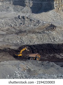 Panoramic Aerial View Of Coal Mine. Open Pit Mine Industry, Big Yellow Mining Truck For Coal Quarry. Open Coal Mining Anthracite Mining. Pit On Coal Mining By Open Way. 