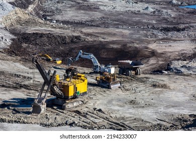 Panoramic Aerial View Of Coal Mine. Open Pit Mine Industry, Big Yellow Mining Truck For Coal Quarry. Open Coal Mining Anthracite Mining. Pit On Coal Mining By Open Way. 