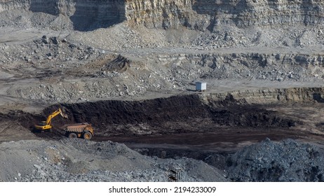 Panoramic Aerial View Of Coal Mine. Open Pit Mine Industry, Big Yellow Mining Truck For Coal Quarry. Open Coal Mining Anthracite Mining. Pit On Coal Mining By Open Way. 