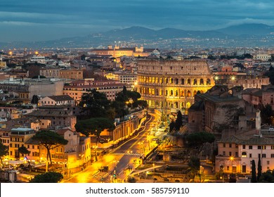 Panoramic Aerial View Of Colosseum In A Summer Night In Rome, Italy