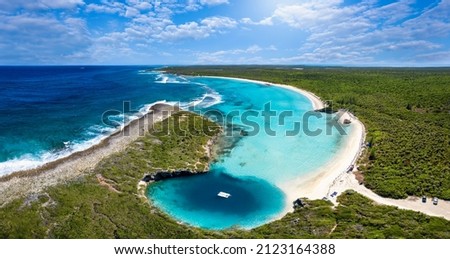 Panoramic aerial view to Dean's blue hole with the connecting lagoon and beautiful beach with turquoise sea, Long Island, Bahamas