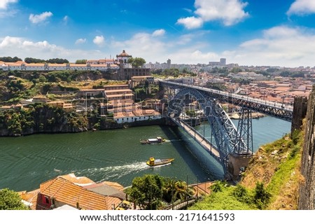 Panoramic aerial view of Dom Luis Bridge in Porto in a beautiful summer day, Portugal