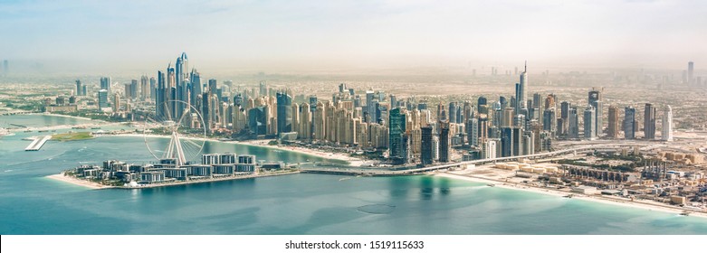 Panoramic aerial view of Dubai Marina skyline with Dubai Eye ferris wheel, United Arab Emirates - Powered by Shutterstock