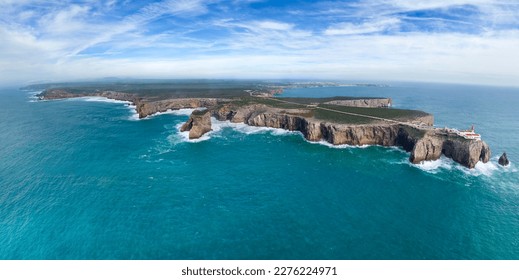 Panoramic aerial view of Farol do Cabo de Sao Vicente, a beautiful lighthouse on the cliff facing the Atlantic Ocean, Sagres, Algarve region, Portugal. - Powered by Shutterstock