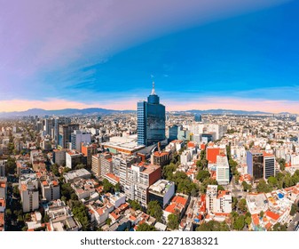Panoramic aerial view of the iconic building of the World Trade Center in Mexico City on a day with a beautiful sunset
