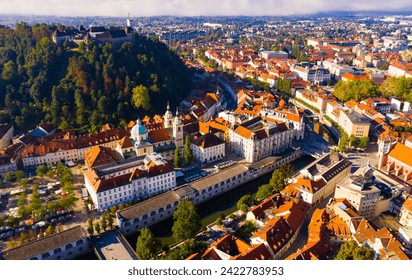 Panoramic aerial view of Ljubljana downtown with ancient castle complex on hilltop in sunny autumn morning, Slovenia - Powered by Shutterstock