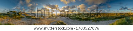 Panoramic aerial view of Lyngvig lighthouse on wide dune of Holmsland Klit with beach view on the west coast of Jutland, by Hvide Sande, Denmark