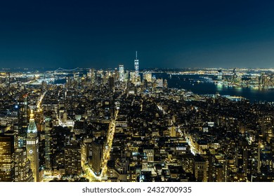 Panoramic aerial view of Manhattan at night in New York City, NY, USA - Powered by Shutterstock