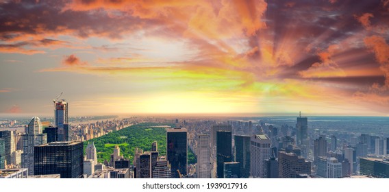 Panoramic aerial view of New York City skyline and Central Park.