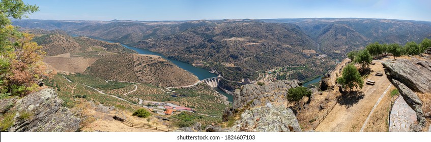 Panoramic aerial view on Penedo Durão viewpoint, typical landscape of the International Douro Park, dam on Douro river and highlands in the north of Portugal, Spain mountains as background ...
