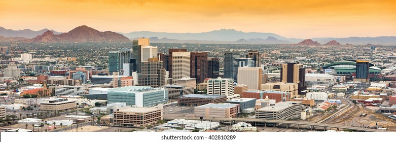 Panoramic aerial view of the Phoenix, Arizona skyline against the day's blue sky. - Shutterstock ID 402810289