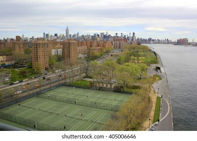 Panoramic Aerial View Of Queens Buildings By East River. Manhattan In The Background. NYC, USA.