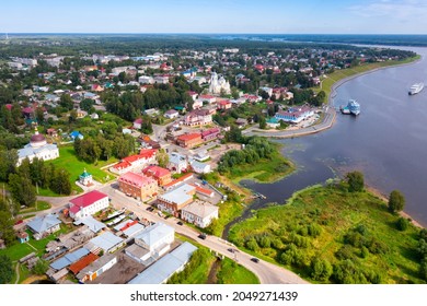 Panoramic Aerial View Of Small Russian Town Of Myshkin In Yaroslavl Oblast On Bank Of Volga River On Sunny Summer Day Overlooking Residential Buildings, Churches And River Station