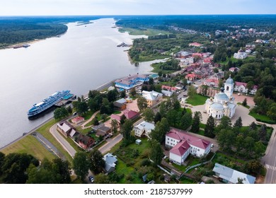 Panoramic Aerial View Of Small Russian Town Of Myshkin In Yaroslavl Oblast On Bank Of Volga River On Sunny Summer Day Overlooking Residential Buildings, Churches And River Station