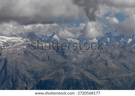Panoramic alpine viewpoint from Pic Blanc at 3300 meters near Alpe d’Huez in the Grandes Rousses massif, French Alps