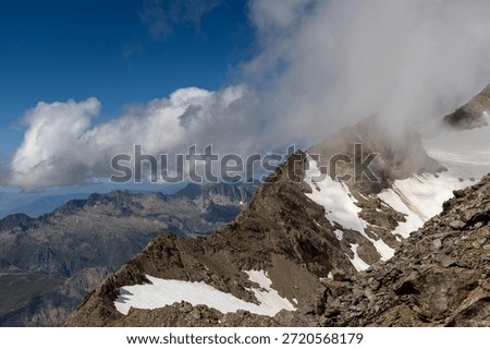 Panoramic alpine viewpoint from Pic Blanc at 3300 meters near Alpe d’Huez in the Grandes Rousses massif, French Alps