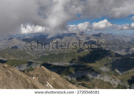 Panoramic alpine viewpoint from Pic Blanc at 3300 meters near Alpe d’Huez in the Grandes Rousses massif, French Alps