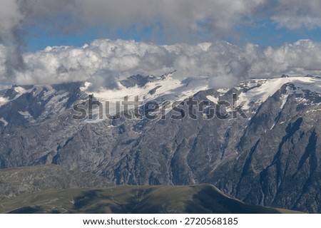 Panoramic alpine viewpoint from Pic Blanc at 3300 meters near Alpe d’Huez in the Grandes Rousses massif, French Alps