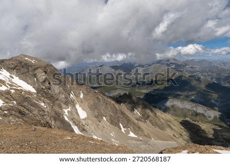 Panoramic alpine viewpoint from Pic Blanc at 3300 meters near Alpe d’Huez in the Grandes Rousses massif, French Alps