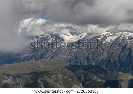 Panoramic alpine viewpoint from Pic Blanc at 3300 meters near Alpe d’Huez in the Grandes Rousses massif, French Alps