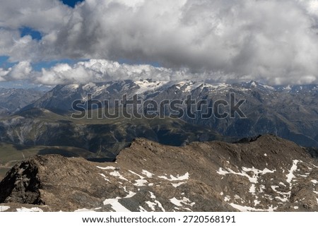 Panoramic alpine viewpoint from Pic Blanc at 3300 meters near Alpe d’Huez in the Grandes Rousses massif, French Alps