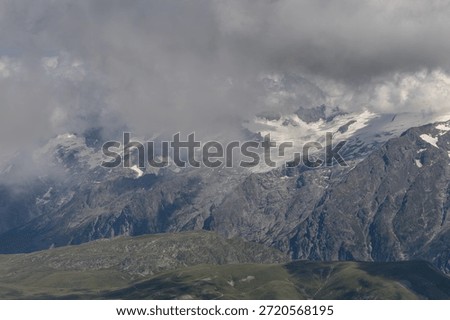 Panoramic alpine viewpoint from Pic Blanc at 3300 meters near Alpe d’Huez in the Grandes Rousses massif, French Alps