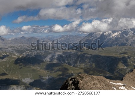 Panoramic alpine viewpoint from Pic Blanc at 3300 meters near Alpe d’Huez in the Grandes Rousses massif, French Alps