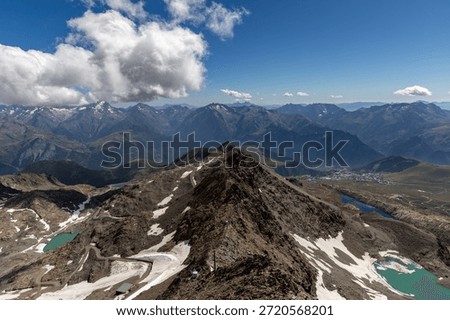 Panoramic alpine viewpoint from Pic Blanc at 3300 meters near Alpe d’Huez in the Grandes Rousses massif, French Alps