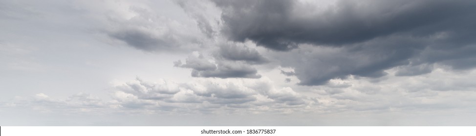 Panoramic background of a gray and stormy sky