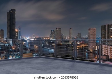 Panoramic Bangkok skyline view, concrete observatory deck on rooftop, night time. Asian corporate and residential lifestyle. Financial city downtown, real estate. Product display mockup empty roof