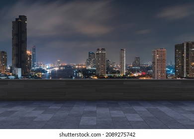 Panoramic Bangkok skyline view, concrete observatory deck on rooftop, night time. Asian corporate and residential lifestyle. Financial city downtown, real estate. Product display mockup empty roof - Shutterstock ID 2089275742