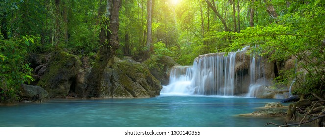Panoramic beautiful deep forest waterfall in Thailand - Shutterstock ID 1300140355