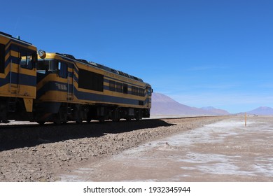 Panoramic Beautiful Horizon View Of Locomotive Train And Railway At Scenic Altiplano Mountain Range Landscape At Andes, Bolivia, South America. Translation: Andean Railway Company. October 14, 2018.