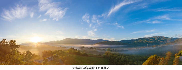 Panoramic Beautiful Misty Morning With Beautiful Sunrise Which Clear Blue Sky In Morning At Doi Mae Salong, Chiang Rai, Thailand.