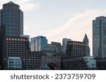 Panoramic city view of Boston Harbour and Seaport Blvd evening and sunset time, Massachusetts. An intellectual, technological and political center.