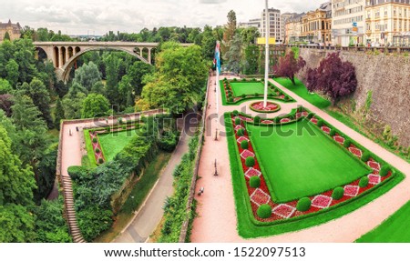 Panoramic city view of Luxembourg city with the famous Adolphe bridge and Constitution square and Park