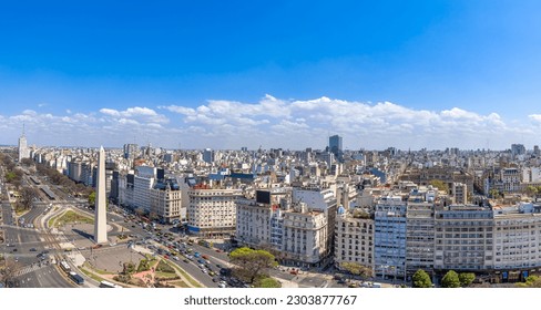 Panoramic cityscape and skyline view of Buenos Aires near landmark obelisk on 9 de Julio Avenue.