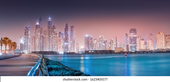 Panoramic cityscape view of skyscrapers and hotel buildings in the Dubai Marina area from the palm Jumeirah island in Dubai. Real estate and tourist attractions in the UAE