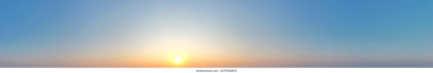 Panoramic of cloudless blue sky full of eveing sunlight.