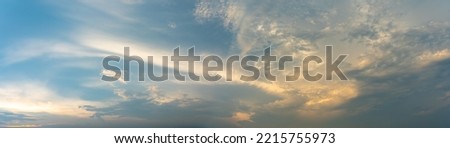 Panoramic cloudscape of dramatic blue sky and clouds at twilight 