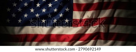 Panoramic dark american flag background with dramatic patriotic folds