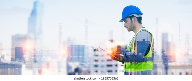 Panoramic double exposure of smart engineer maintenance in solar power plant checking installing photovoltaic solar modules with digital tablet with Oil and gas refinery industry plant background.