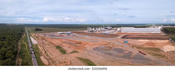 Panoramic Drone Aerial View Of BR-163 Road And Deforested Area With Industrial Factory Building In The Amazon, Brazil. Concept Of Urbanization, Environment, Ecology, Industry, Climate Change.