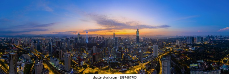 Panoramic Drone Aerial View Of Sunrise At Kuala Lumpur City Skyline. Empty City Lockdown Coronavirus Concept. Image May Contain Noise Due To Low Light And High ISO Setting. 