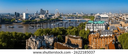 Panoramic drone image of London’s skyline featuring the River Thames, The Shard, and commercial architecture—ideal for business, travel, and real estate use