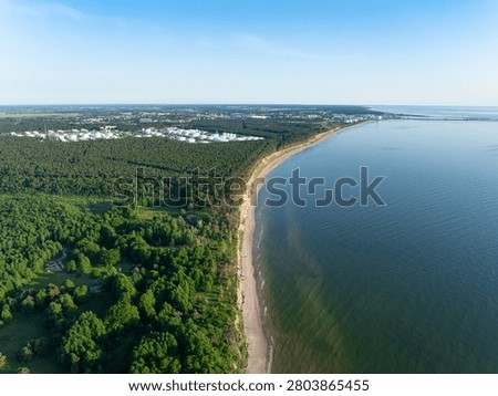 Panoramic drone view of Staldzene Cliffs, Baltic Sea coastline, Ventspils oil terminal and port in Latvia