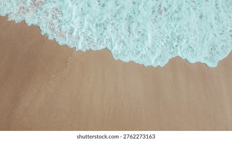 Panoramic drone view of waves breaking on golden beaches
